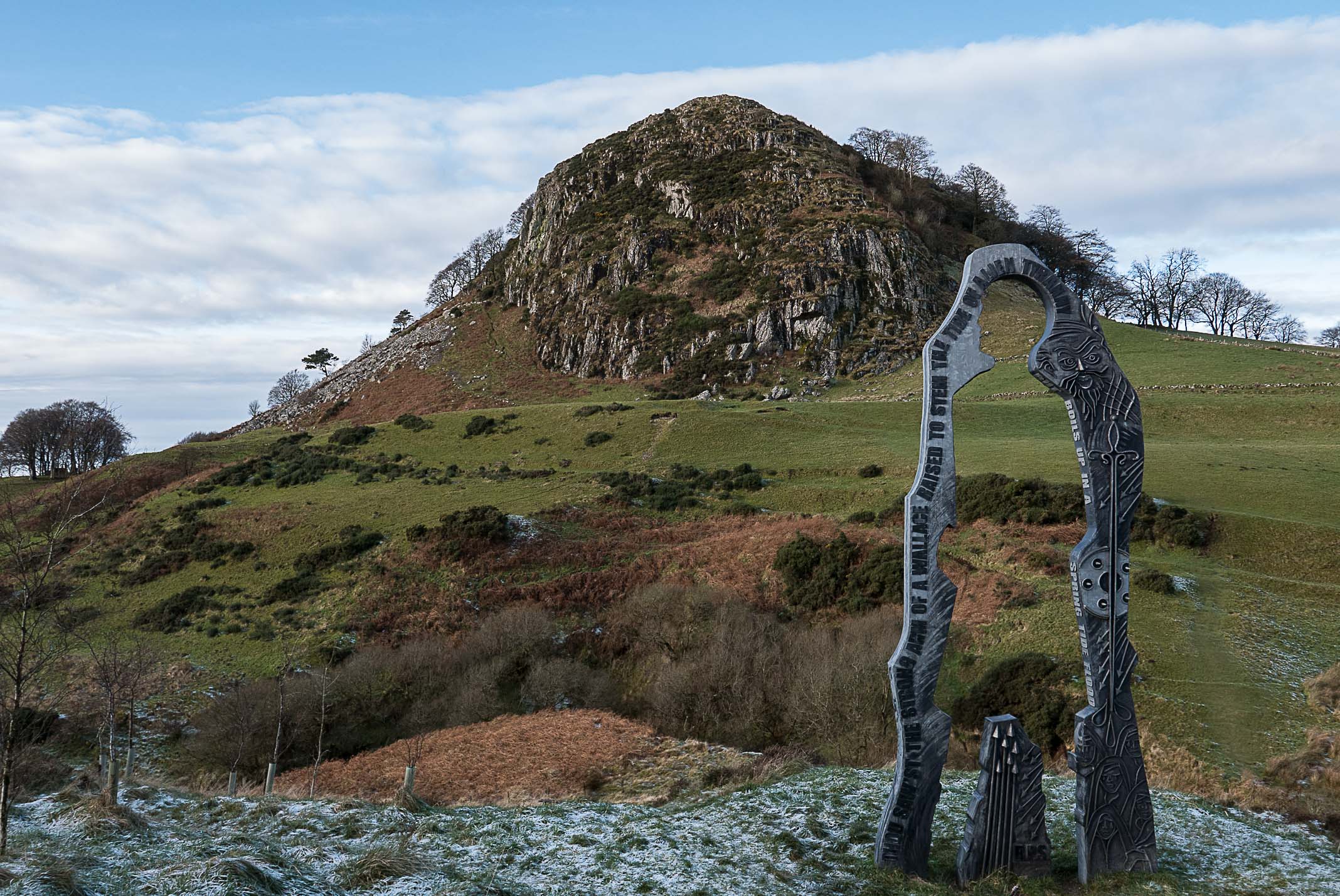 Spirit of Scotland statue with Loudoun Hill in the background